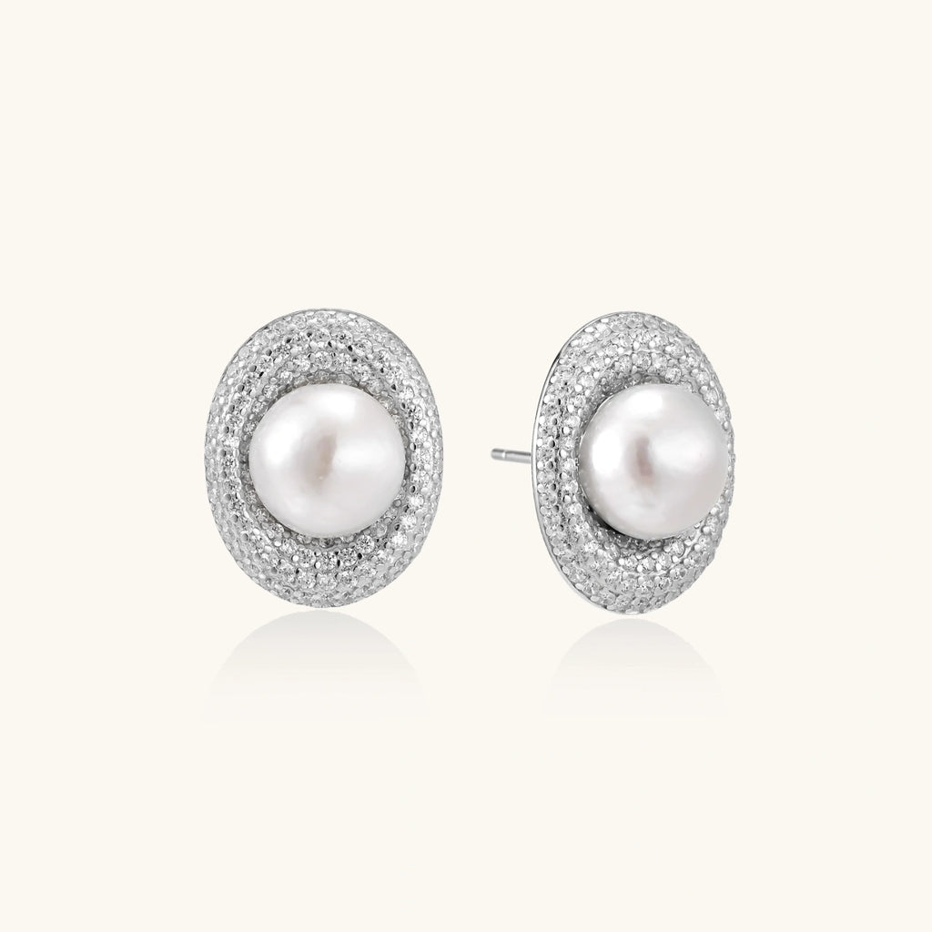 Close-up of freshwater pearl halo studs with pave crystal in rhodium-plated silver