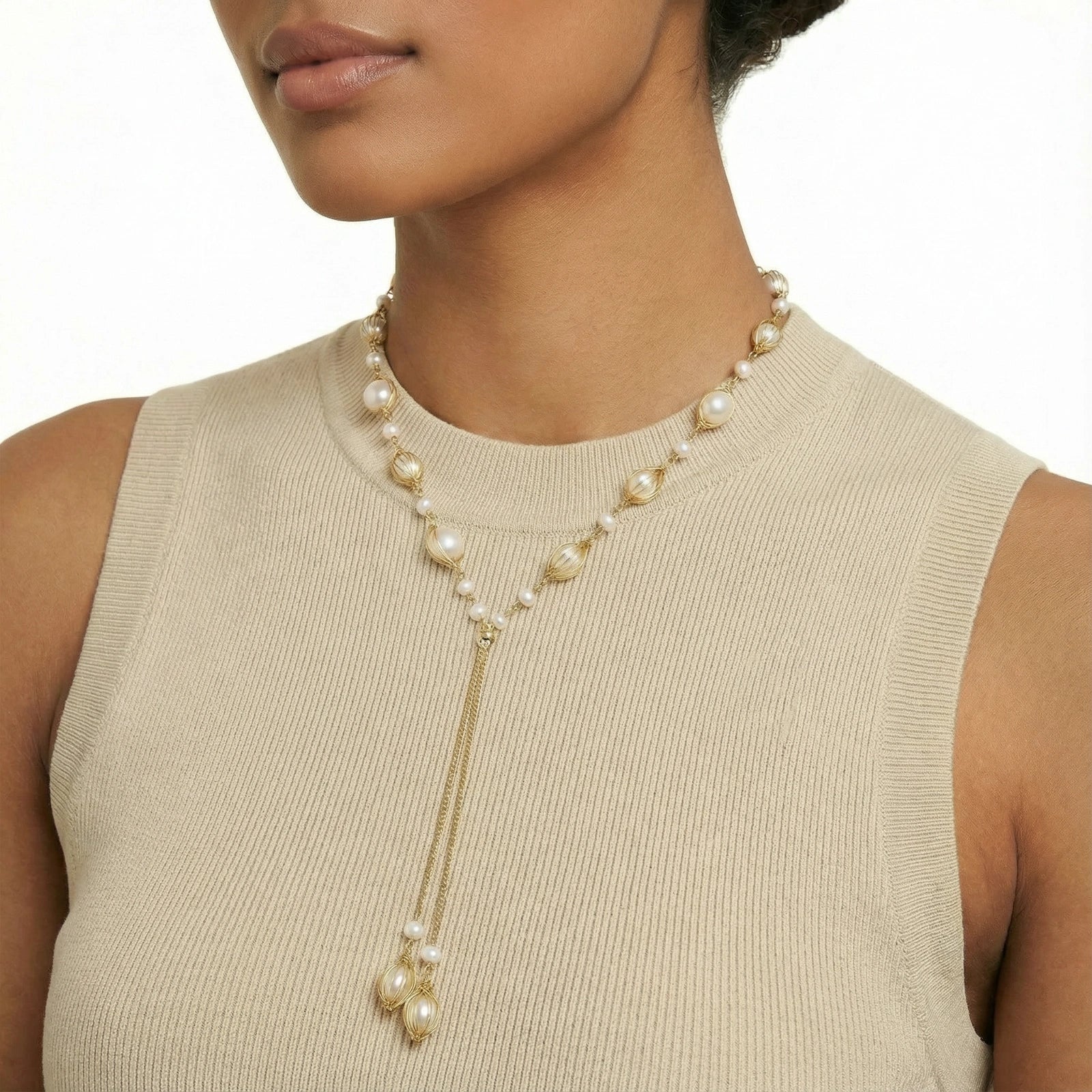Woman wearing freshwater pearl lariat necklace close up on neckline VAHN Jewels