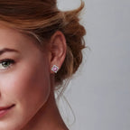 Woman wearing pink moissanite halo stud earrings in silver | VAHN Jewels