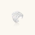 Side view of carved ridge silver ring showing wave texture in 925 sterling silver