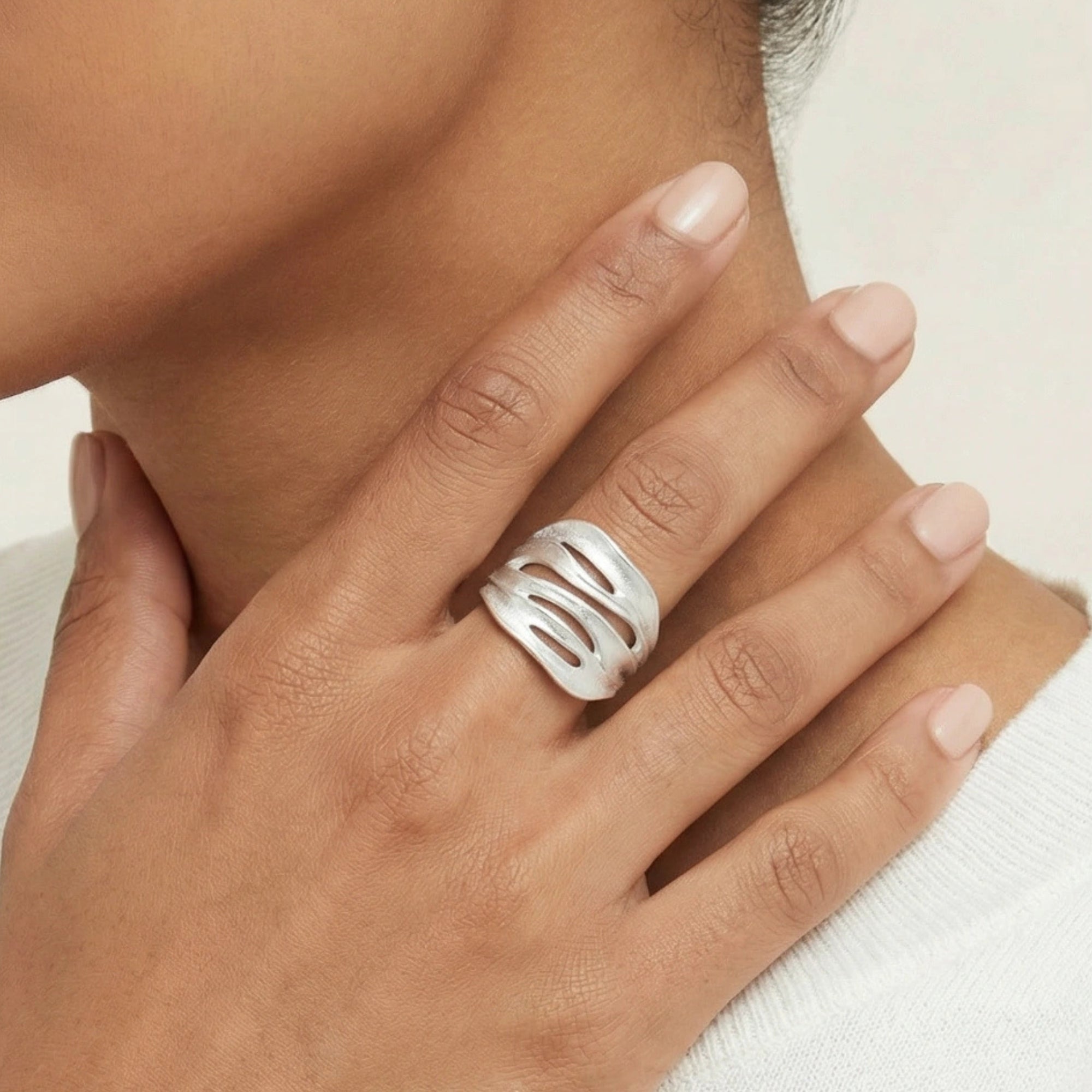 Woman wearing wide ridged silver statement ring | VAHN Jewels