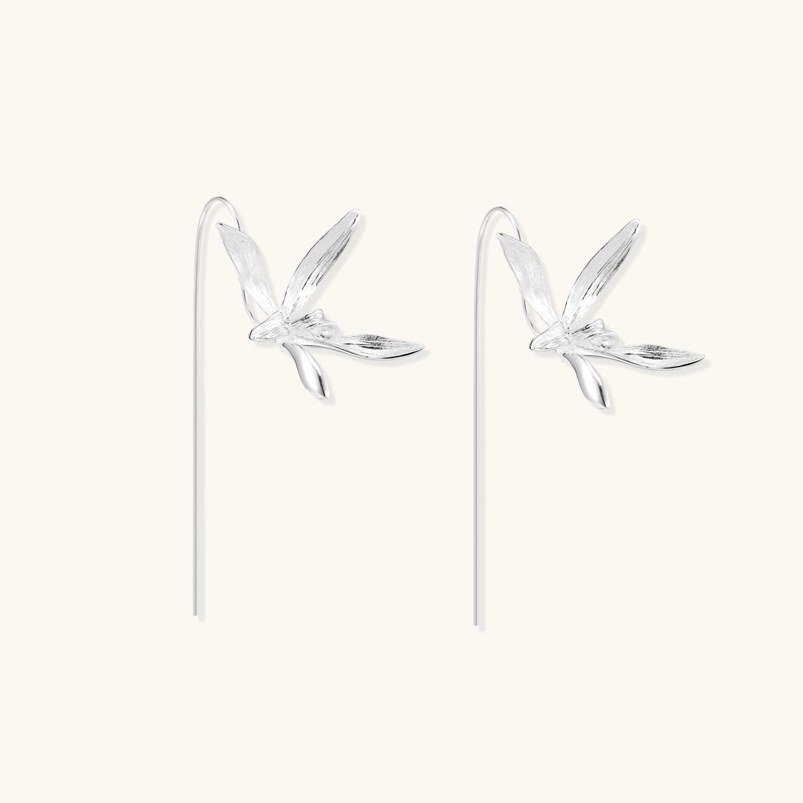 Detail view of brushed dragonfly wings on 925 sterling silver threader earrings by VAHN Jewels