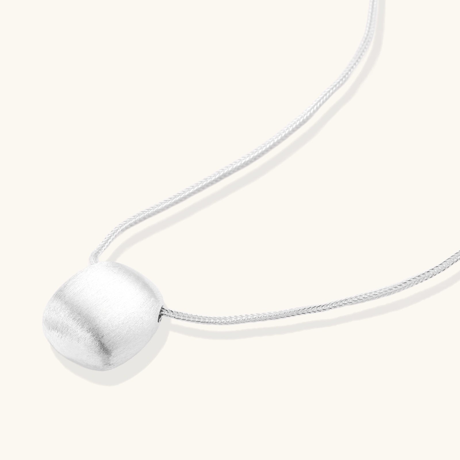 Close up of brushed silver sphere pendant on adjustable 925 silver chain VAHN Jewels