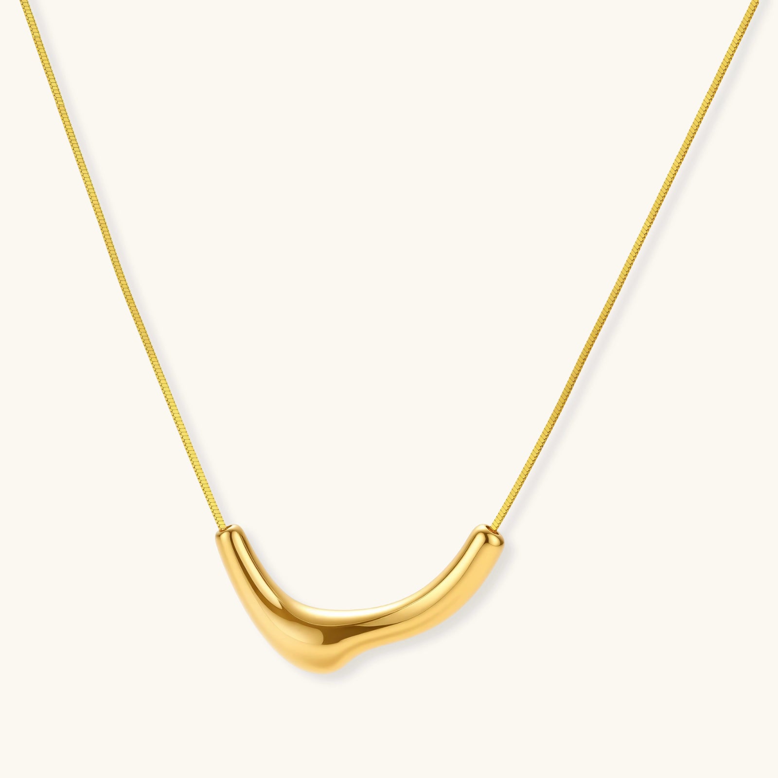 Sleek curve pendant gold necklace in 18K gold-plated 925 sterling silver with sculptural arc pendant by VAHN Jewels