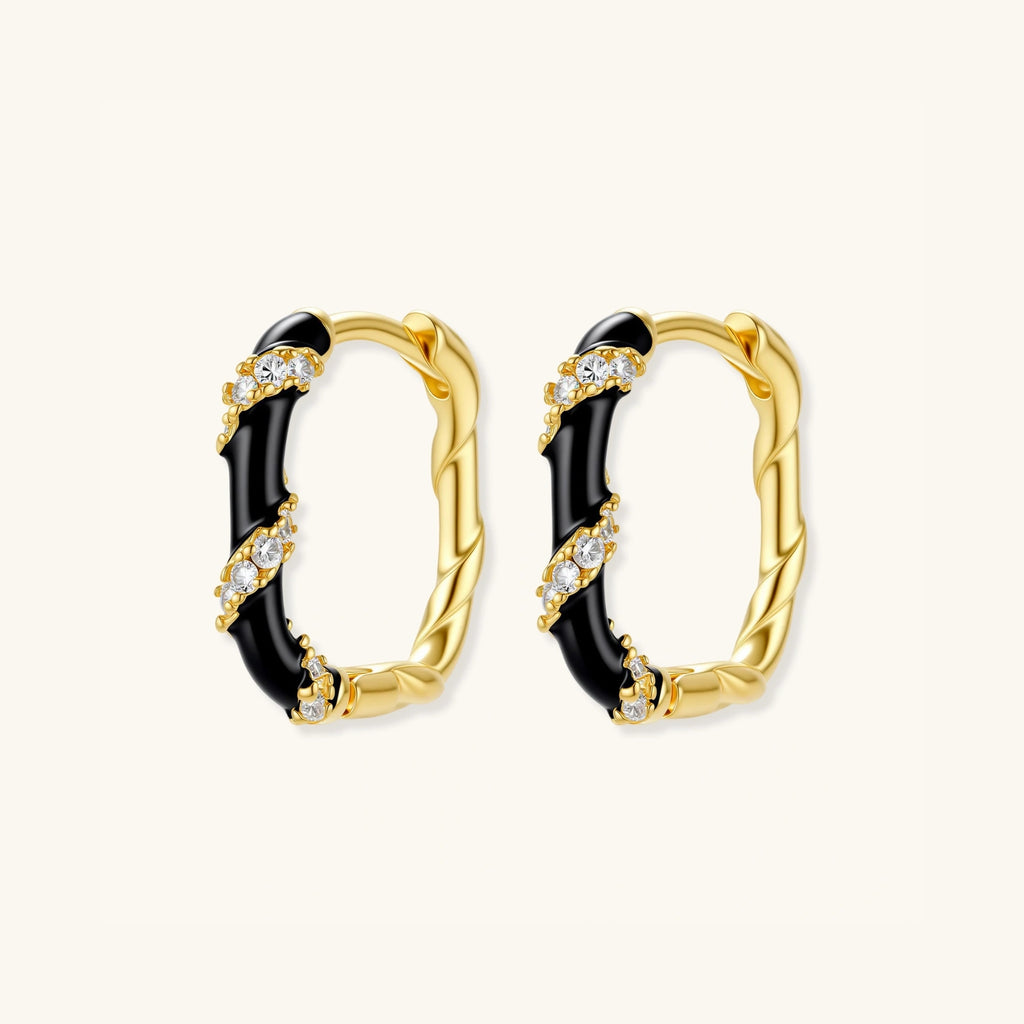 Pair of black and gold striped demi-fine hoop earrings in 14K gold-plated sterling silver