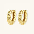 Standing view of twisted rope gold huggie earrings showing thick rope texture in 14K gold-plated 925 silver by VAHN Jewels