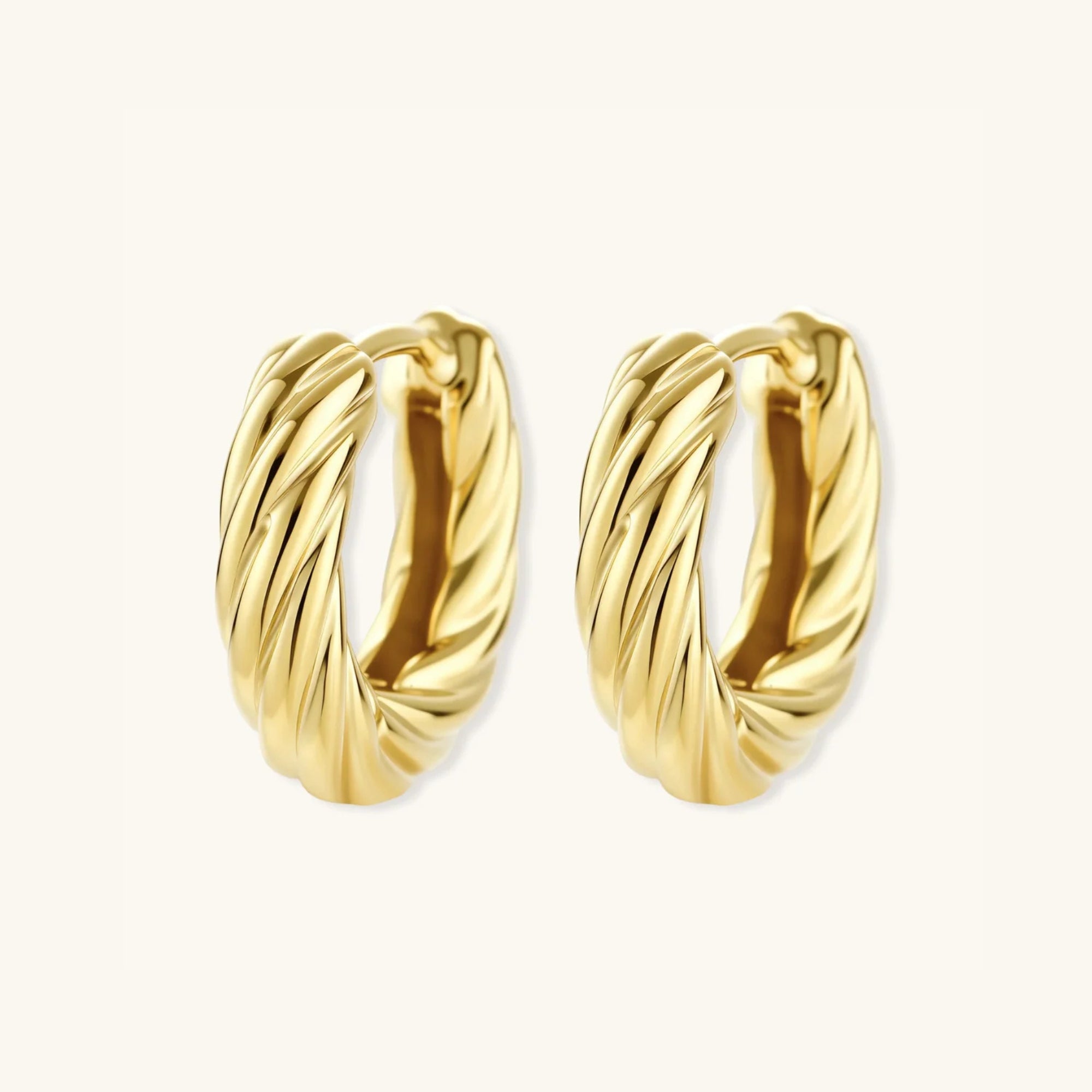 Standing view of twisted rope gold huggie earrings showing thick rope texture in 14K gold-plated 925 silver by VAHN Jewels
