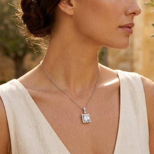 Woman wearing Art Deco moissanite pendant necklace in 925 sterling silver by VAHN Jewels