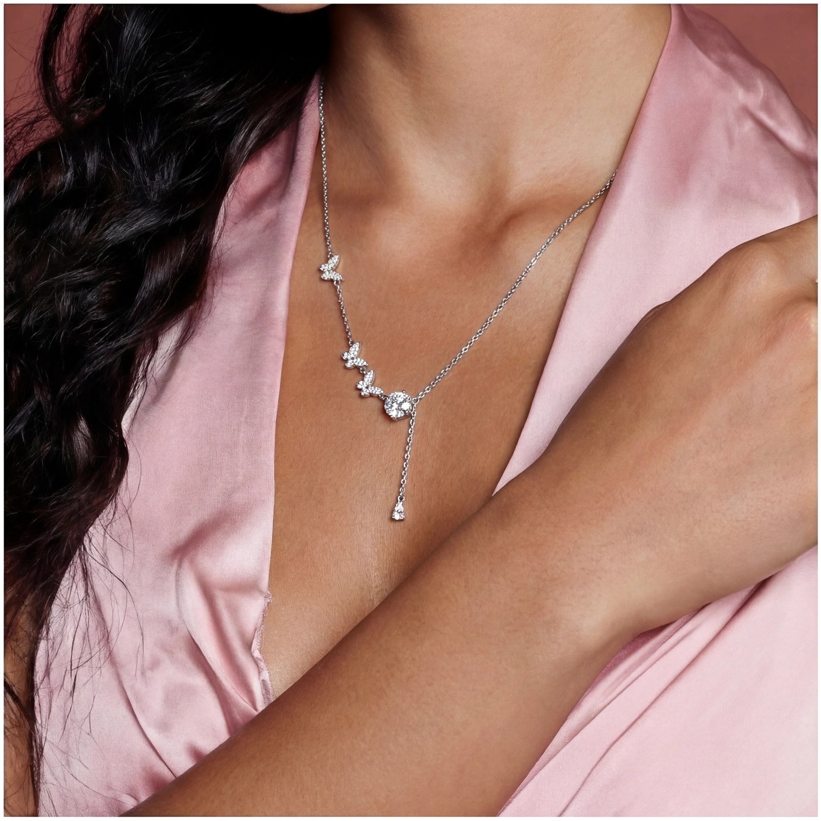 Woman wearing Flutter Dreams moissanite lariat necklace in 925 sterling silver by VAHN Jewels
