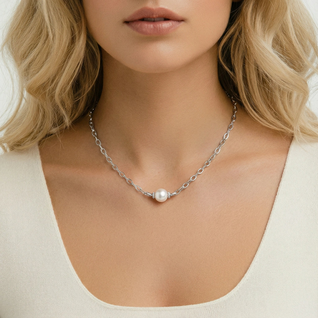 Woman wearing Luna Pearl Chain necklace in rhodium-plated 925 sterling silver with single freshwater pearl by VAHN Jewels