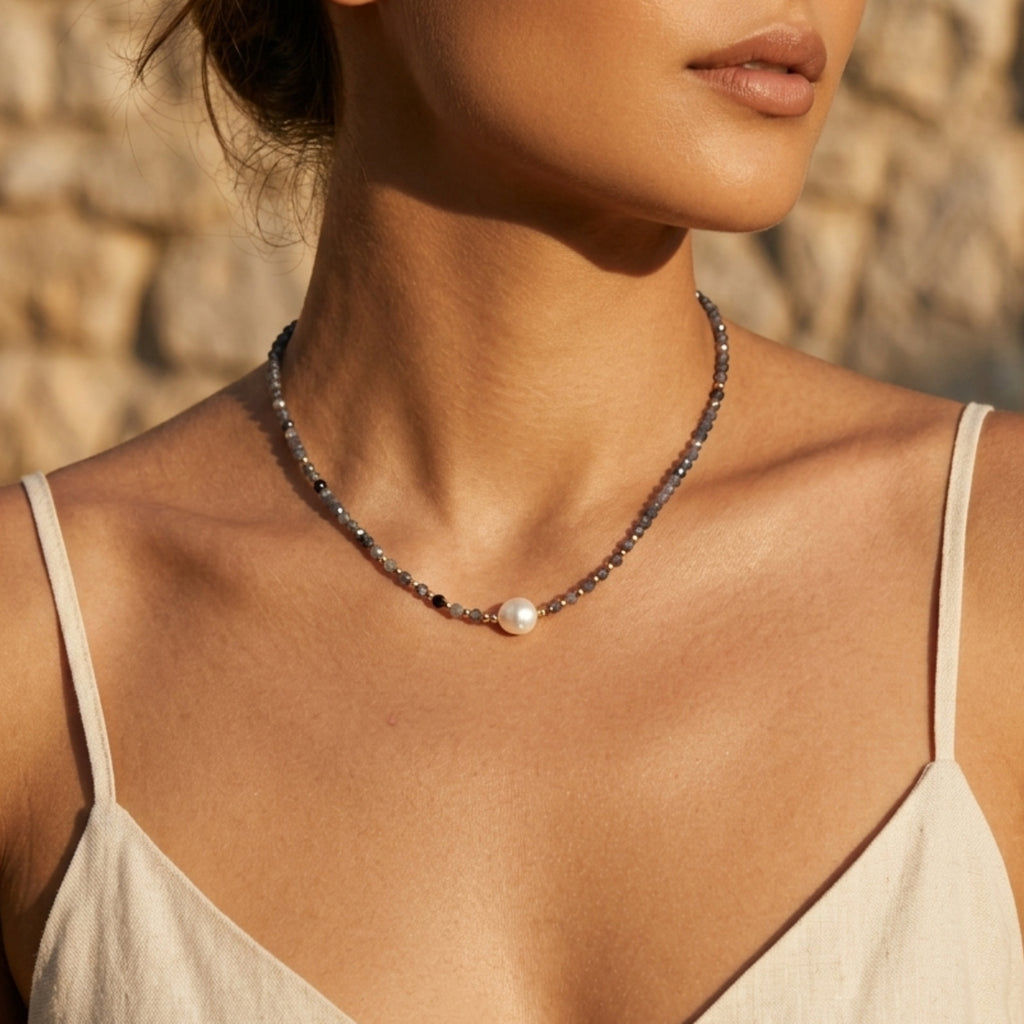 Woman wearing twilight iolite pearl necklace with faceted iolite beads and freshwater pearl by VAHN Jewels