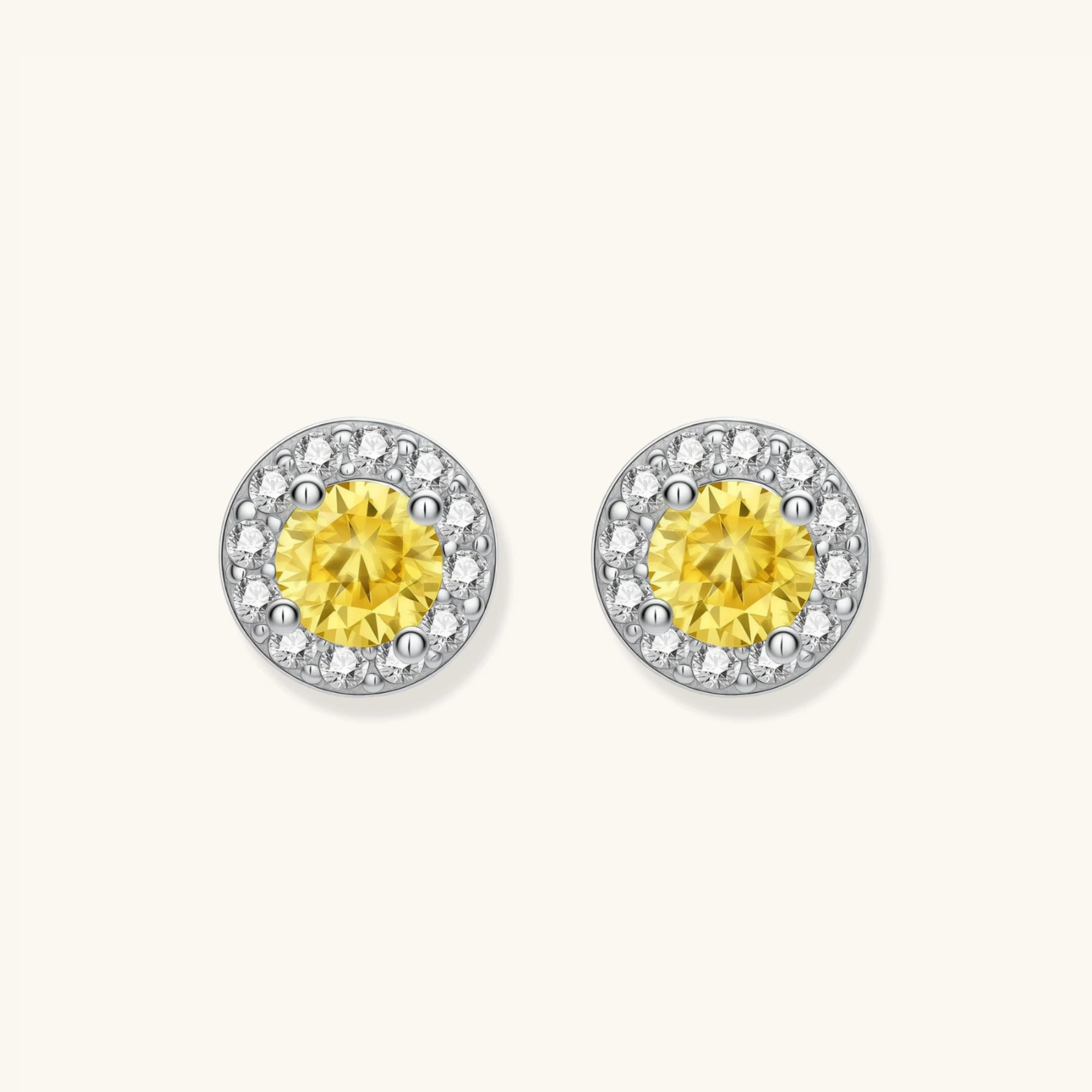 Yellow moissanite halo stud earrings in 925 sterling silver with 0.1ct VVS1 yellow moissanite and pave zirconia halo by VAHN Jewels