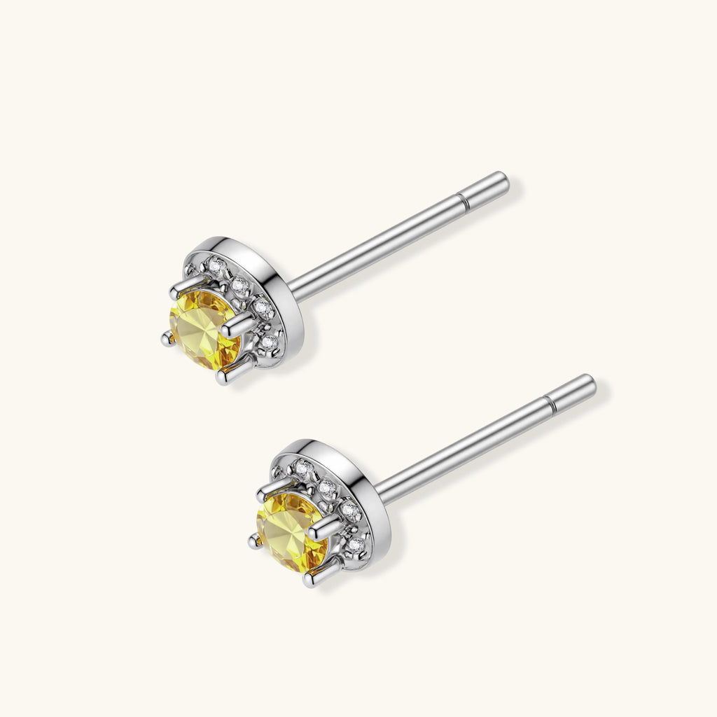 Side profile of yellow moissanite halo stud earrings showing post backing and stone depth by VAHN Jewels