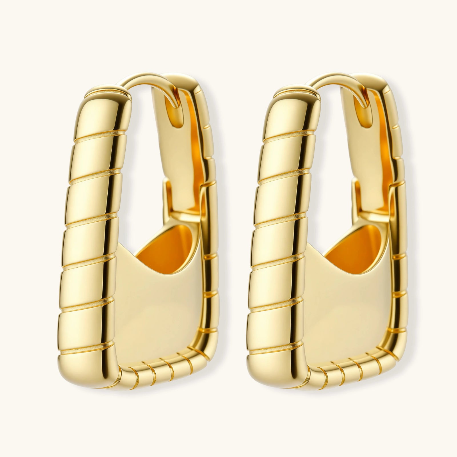 Bamboo huggie hoop earrings in 18K gold plated 925 silver on white backgroundbackground.