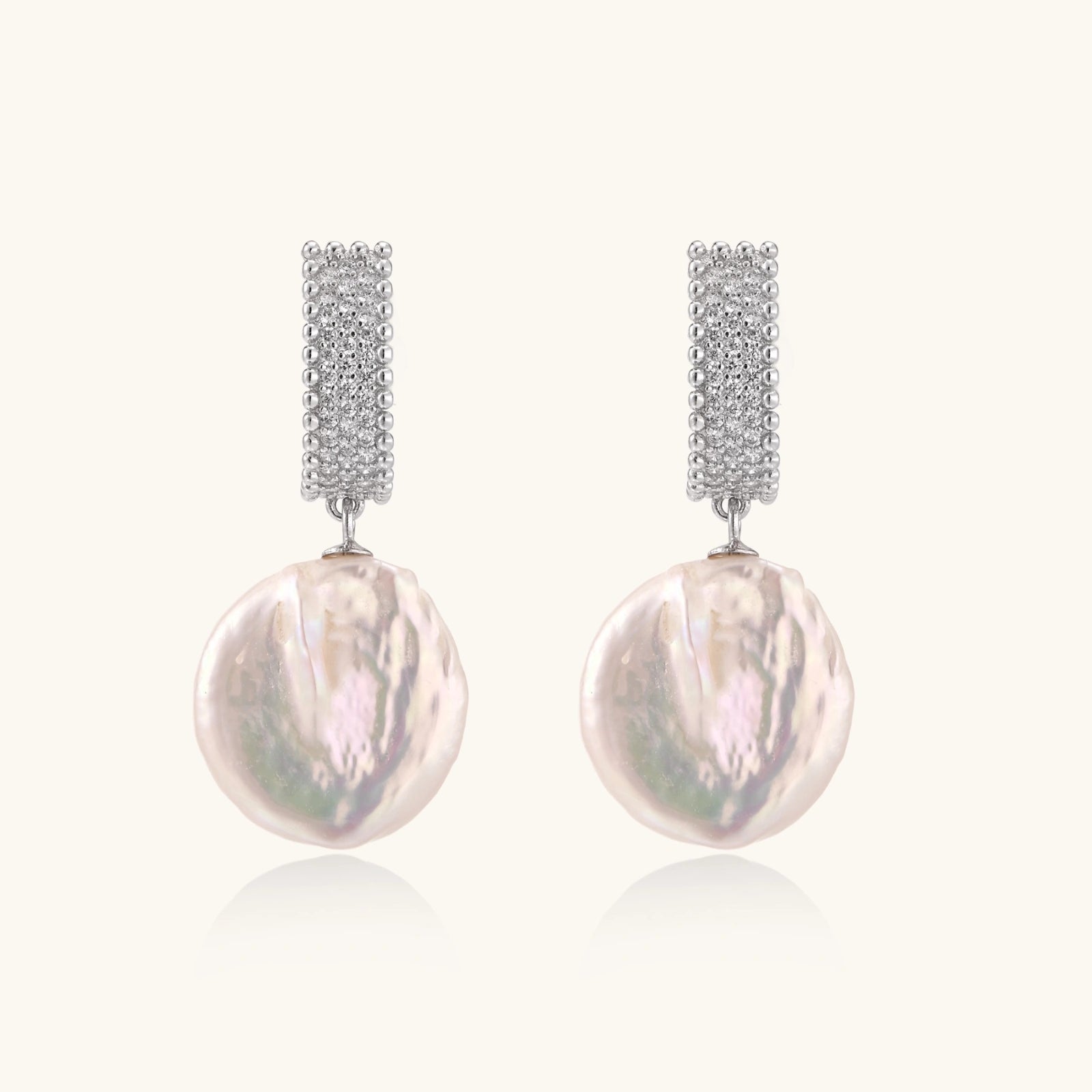 Side view of oversized baroque pearl drop earrings in rhodium 925 silver