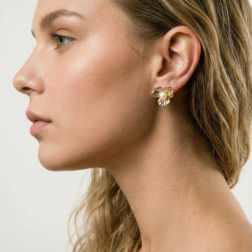 Woman wearing bloom pearl stud earrings — delicate everyday gold jewelry
