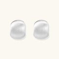 Brushed silver stud earrings in pure sterling silver dome on white background