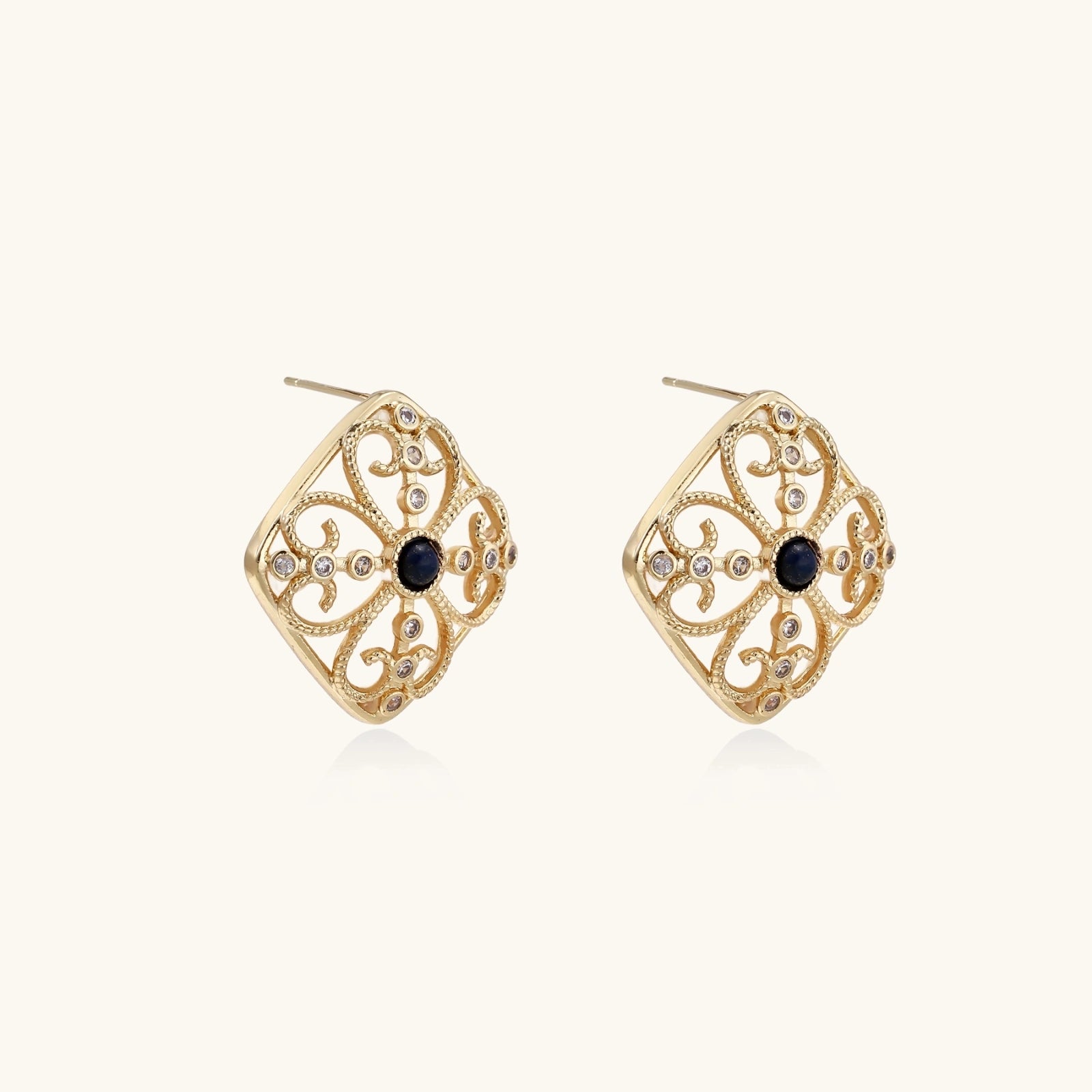 Close-up of lapis lazuli and MOP accents on gold Byzantine filigree stud earrings