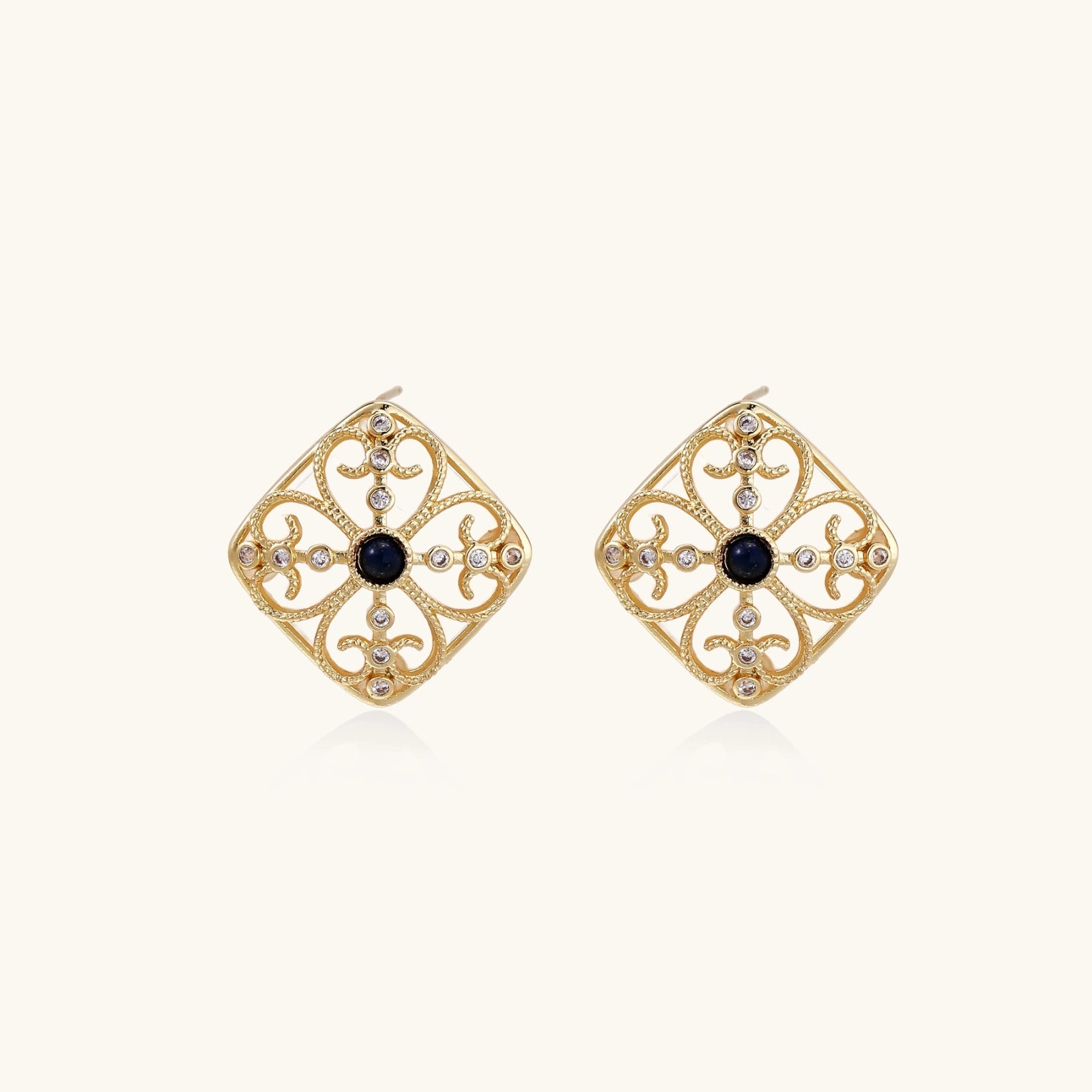 Byzantine dream stud earrings in gold filigree with lapis lazuli on white background