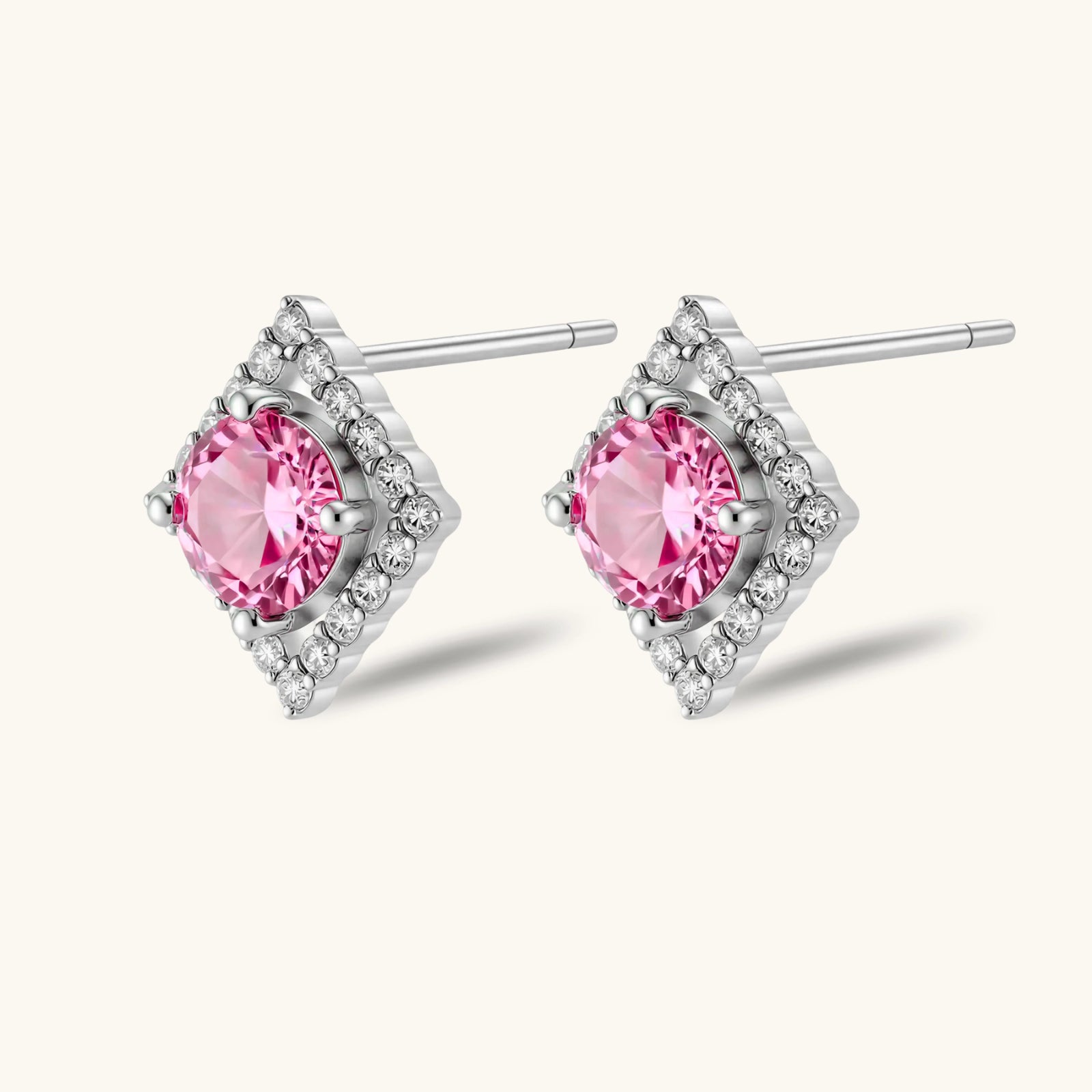 Close-up of VVS1 pink moissanite set in geometric diamond halo silver earrings