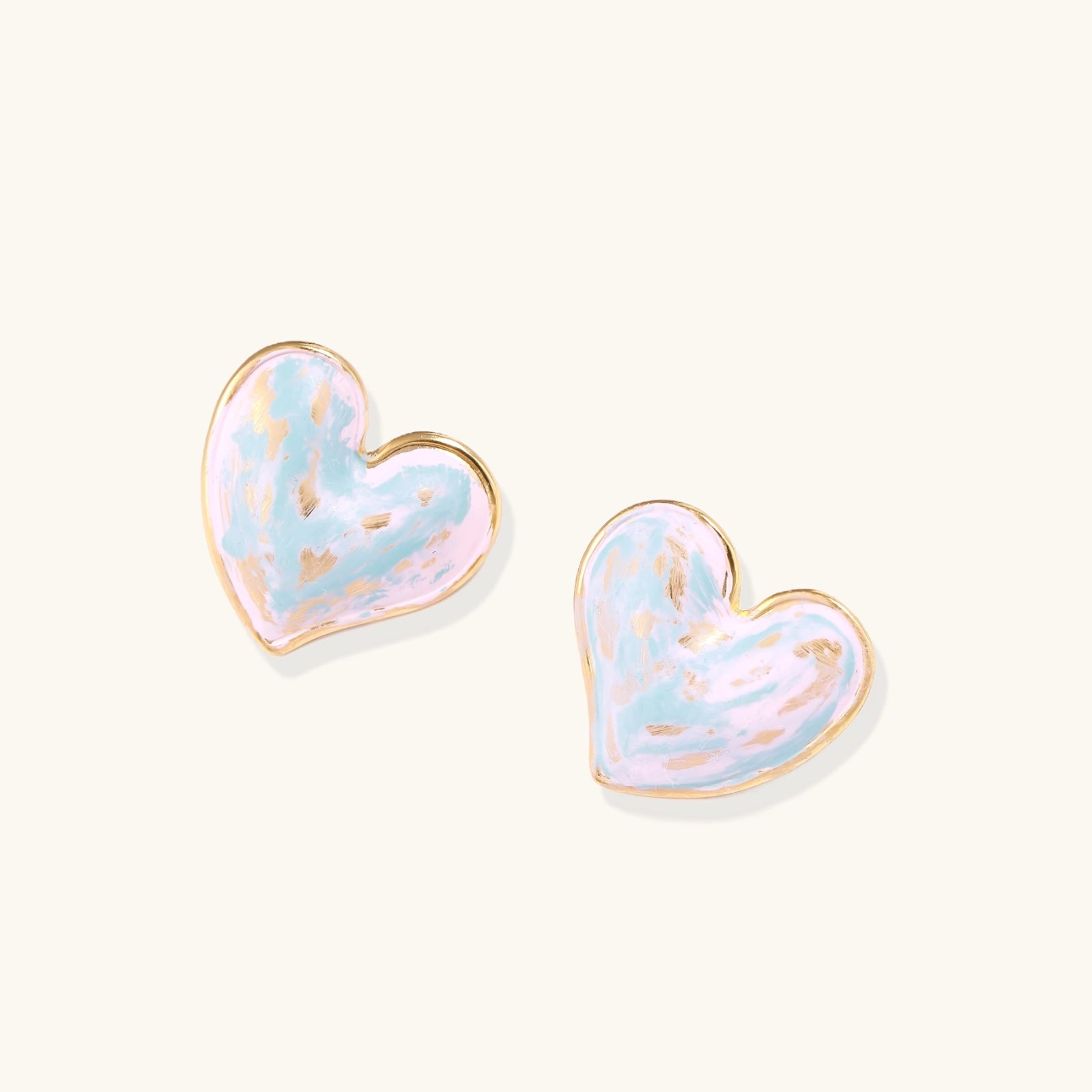 Detail of swirling pink and blue enamel on dreamy heart stud earrings