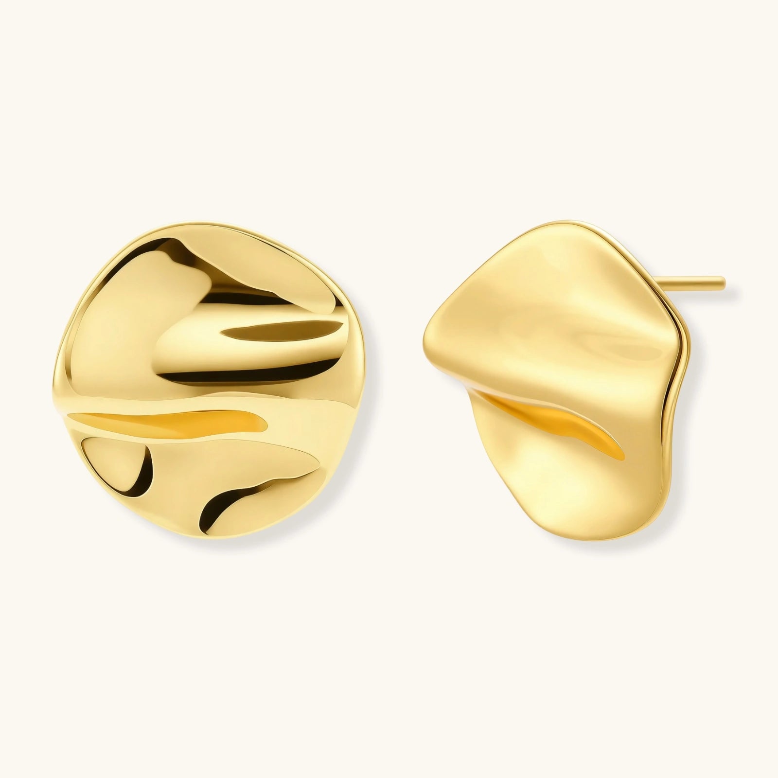 Close-up of organic gold-plated Pair of sculptural gold flow statement stud earrings — organic molten design