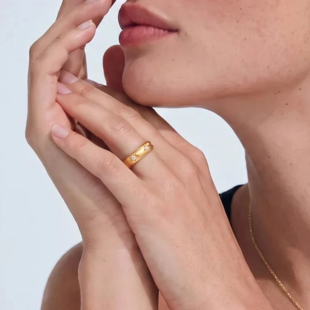 Brushed gold cuff ring with star accents worn on the hand | VAHN Jewels