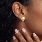 Brushed gold dome halo stud earring worn on the ear | VAHN Jewels
