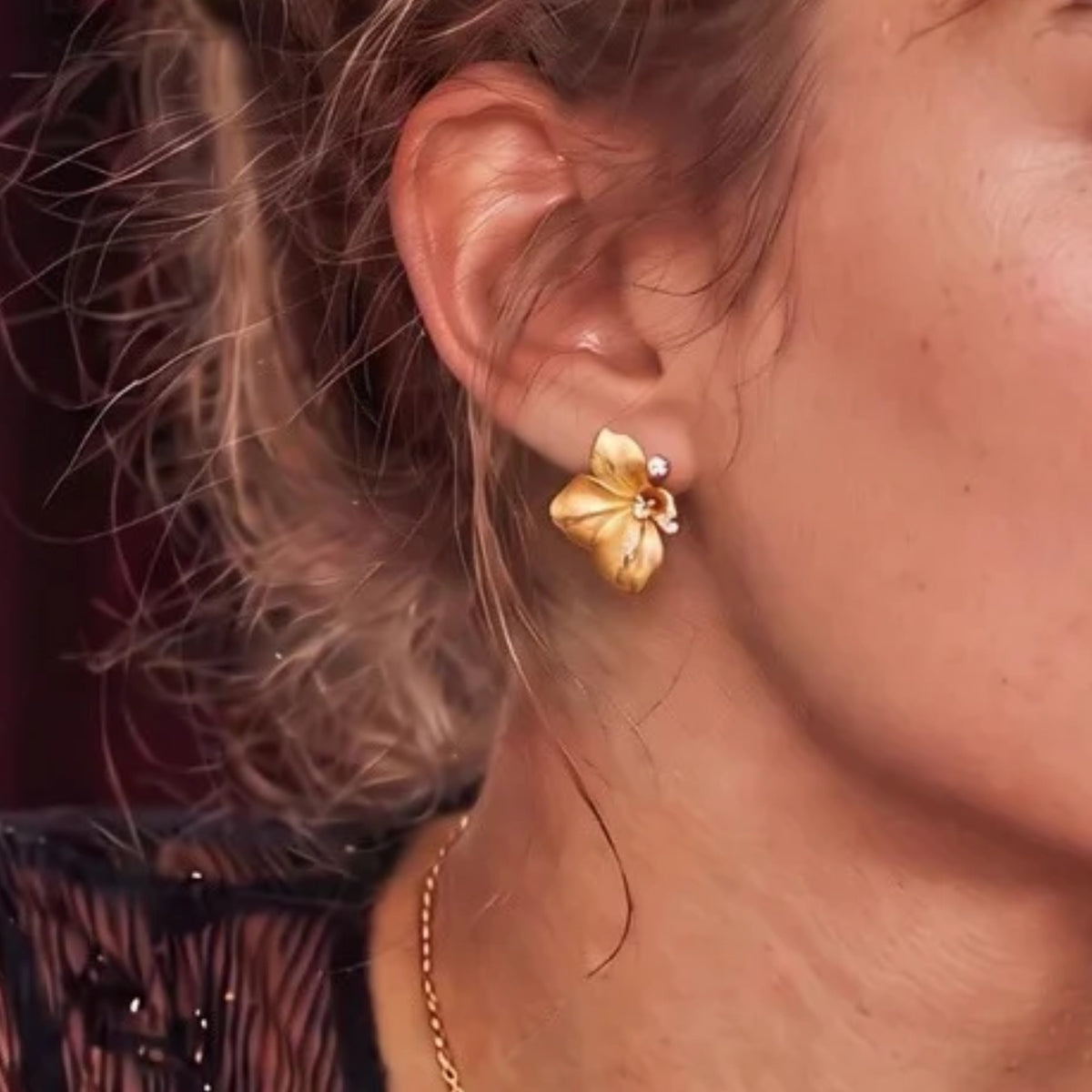 Brushed gold flower stud earring worn on the ear | VAHN Jewels
