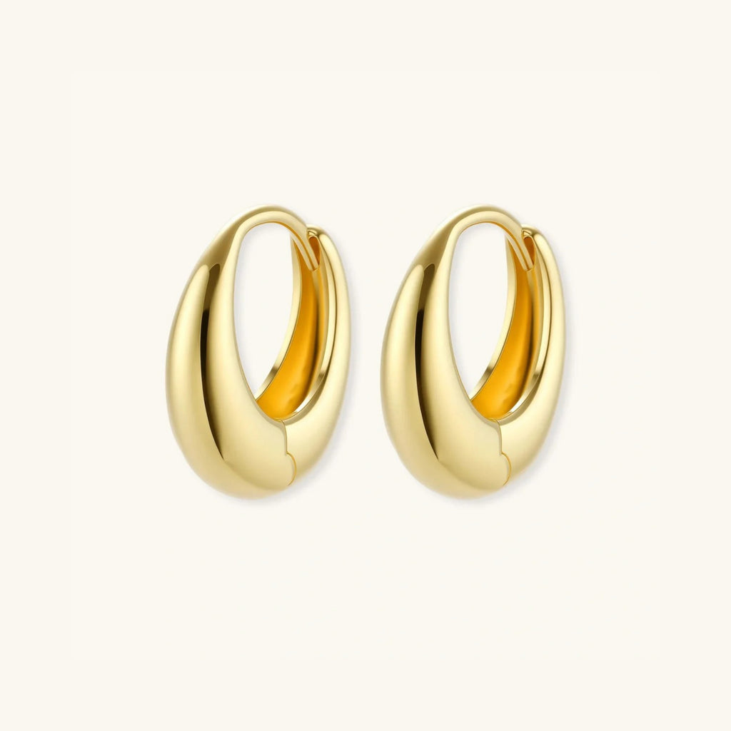 Gold teardrop huggie earrings showing thick profile and hinged closure | VAHN Jewels
