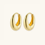 Gold teardrop huggie earrings showing thick profile and hinged closure | VAHN Jewels