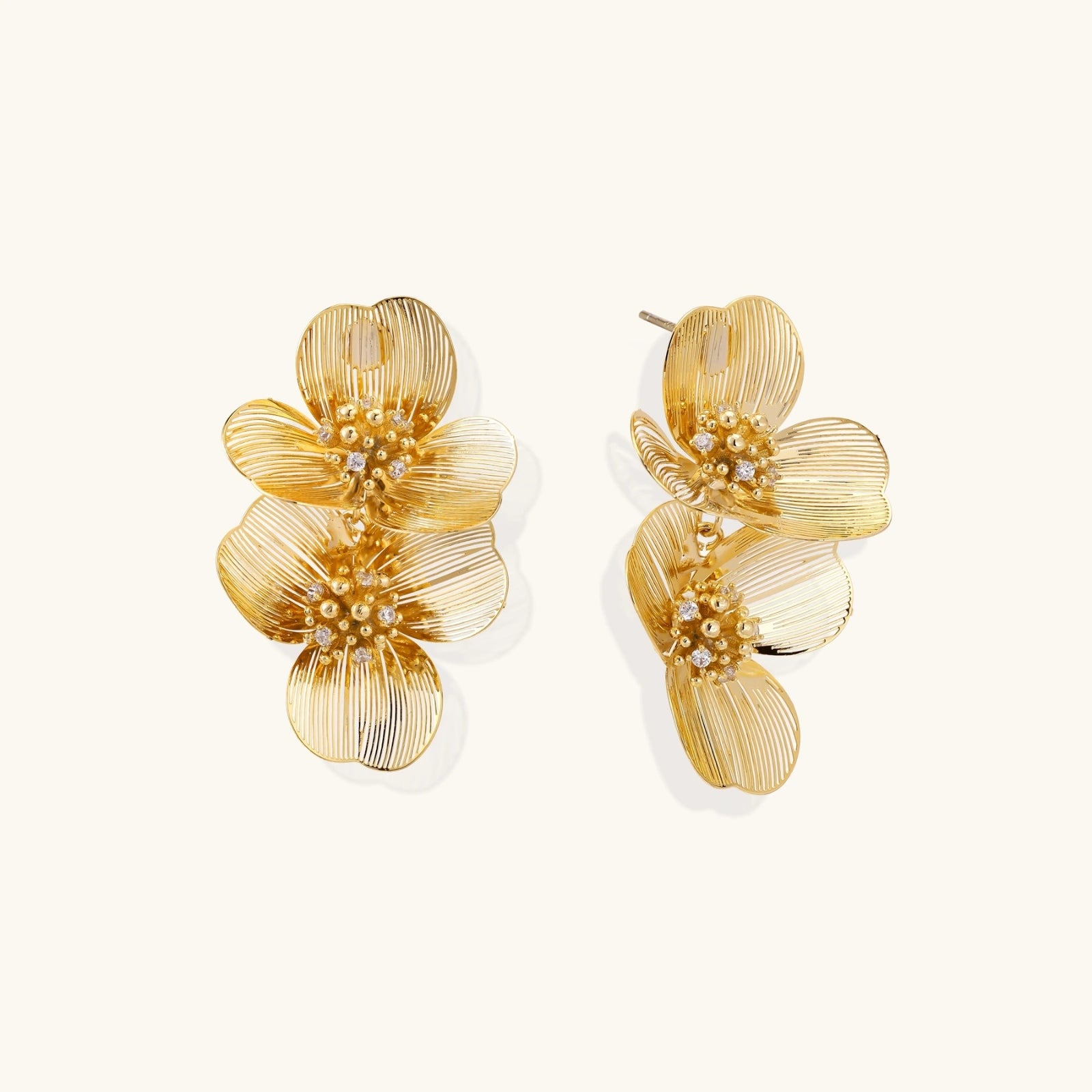 Pair of sculptural golden bloom double floral stud earrings in gold eco-brass