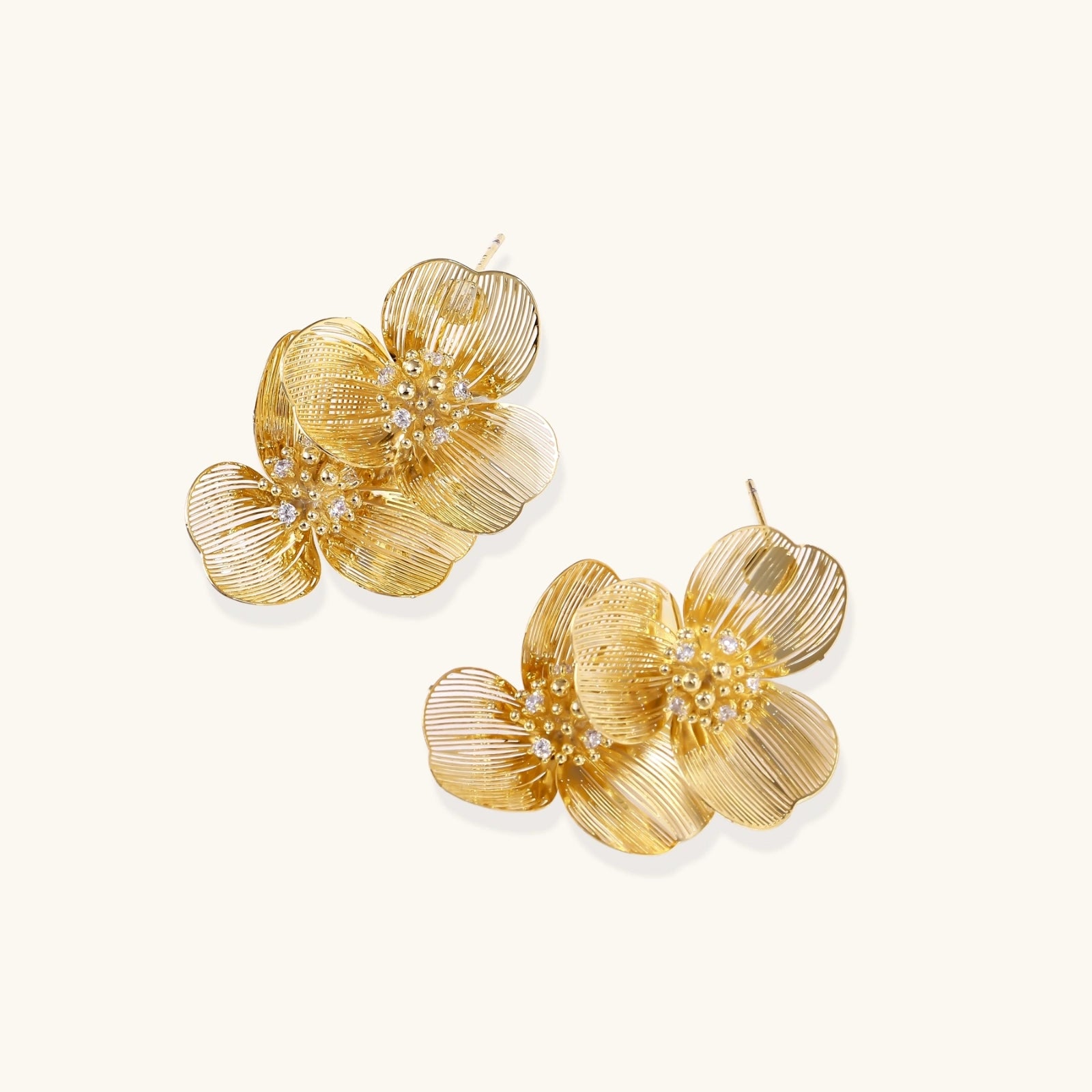  Side view of dimensional golden bloom double earrings with ribbed petal detail