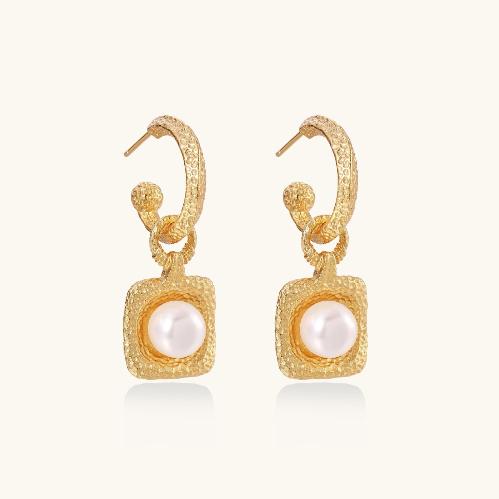 Side view of baroque-inspired gold vermeil pearl drop hoop earrings