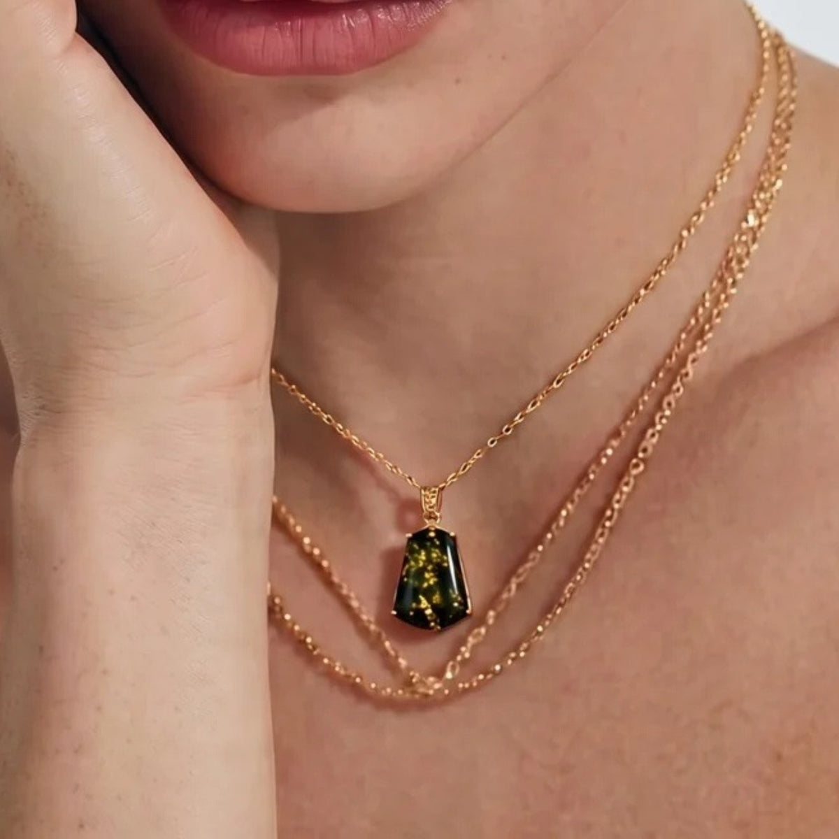 Green amber pendant necklace layered on a fine gold chain | VAHN Jewels