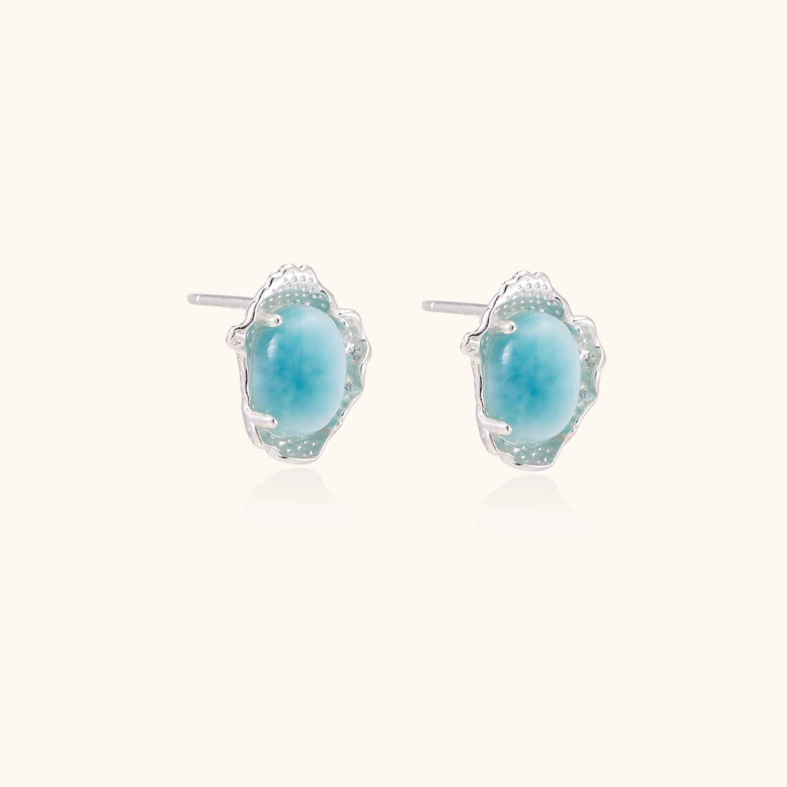 Close-up of rare Caribbean larimar stone set in rhodium silver stud earrings