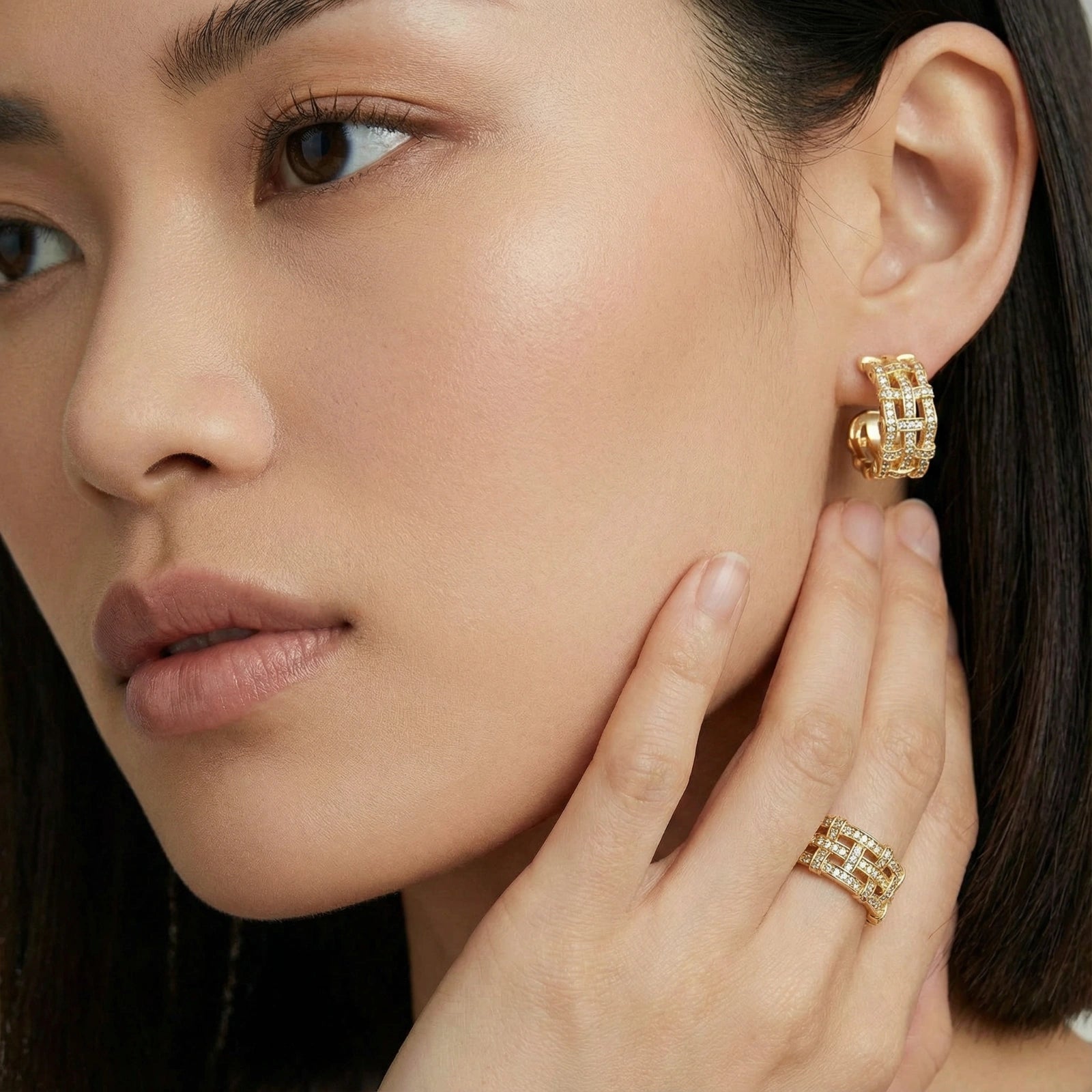 Woman wearing lattice dream hoop earrings — bold architectural gold jewelry