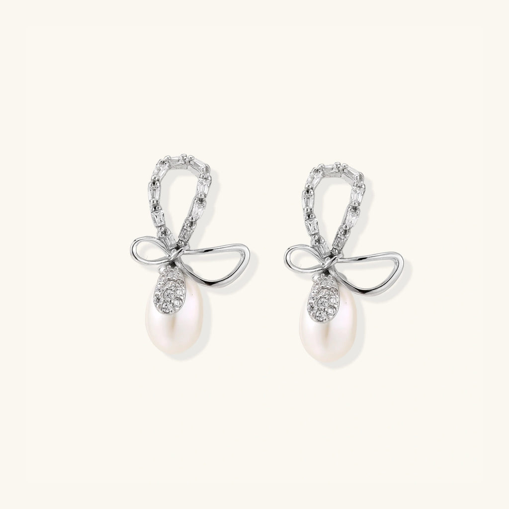 Crystal bow pearl drop earrings with freshwater pearl and pave crystal in rhodium-plated 925 sterling silver, front view | VAHN Jewels