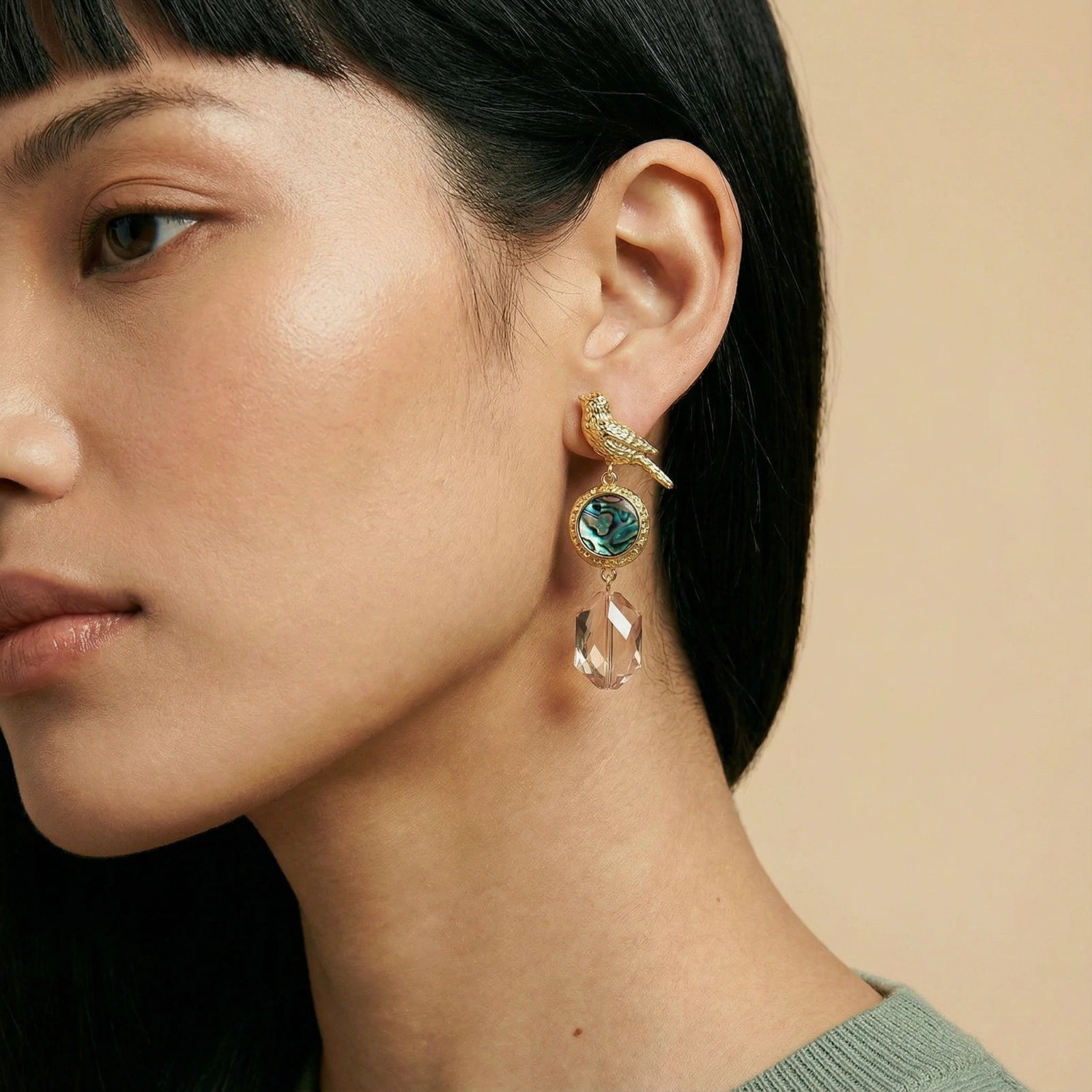 Woman wearing songbird abalone drop earrings — ethereal statement jewelry