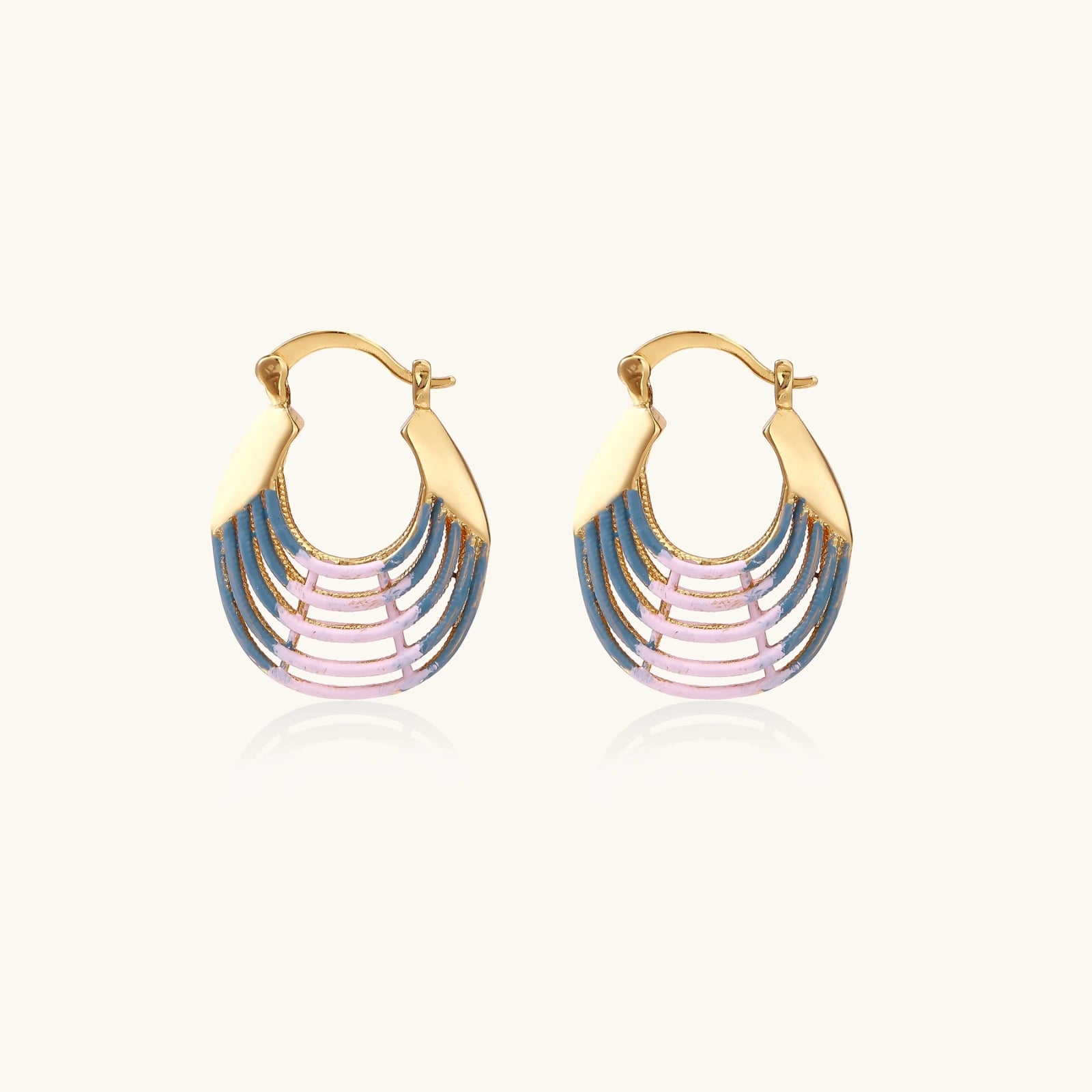 Sunrise ripple hoop earrings in hand-painted blue and pink enamel on white background