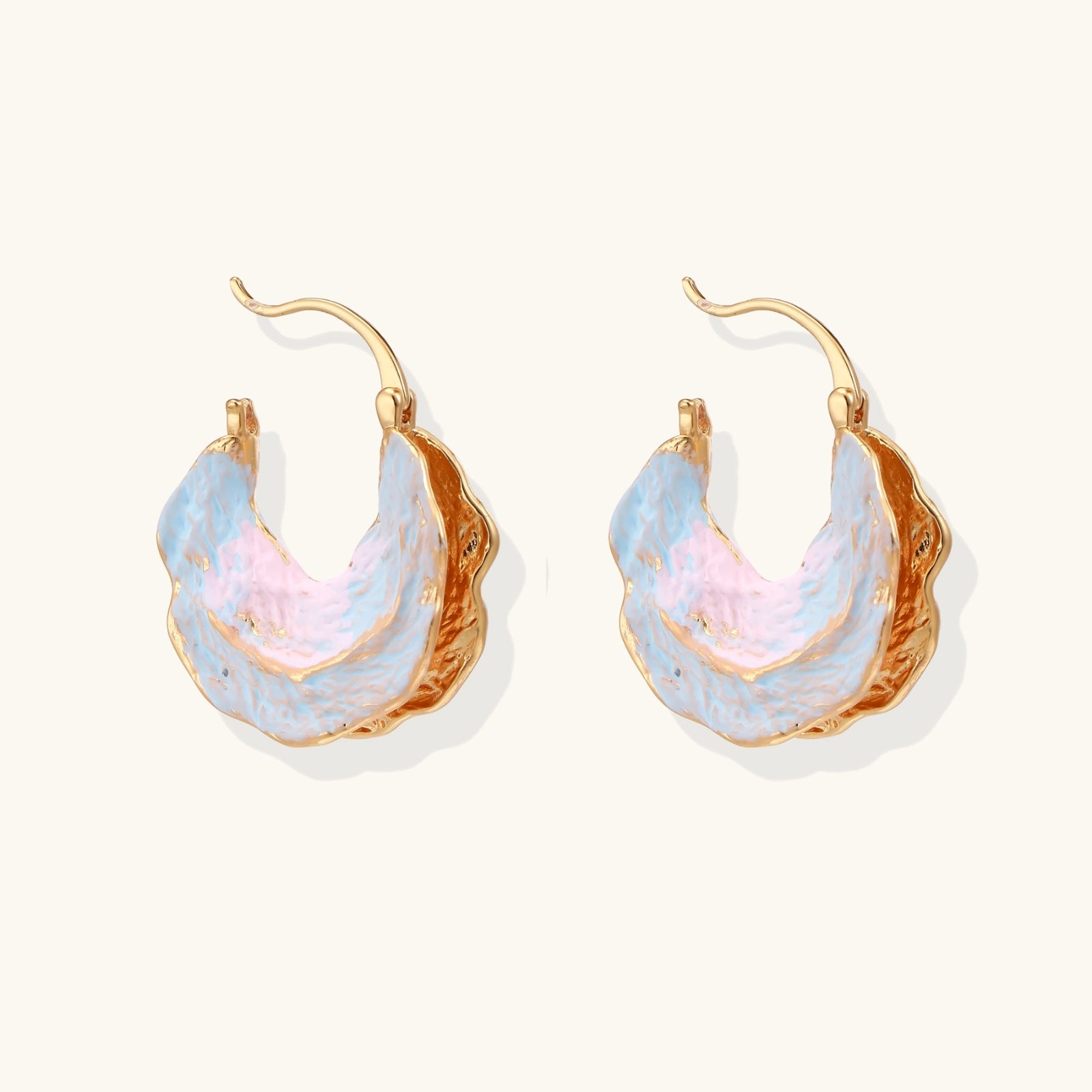  Side view of organic shaped tide pool hoop earrings in iridescent enamel