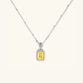 Yellow moissanite halo pendant necklace in platinum-plated 925 sterling silver | VAHN Jewels