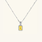 Yellow moissanite halo pendant necklace in platinum-plated 925 sterling silver | VAHN Jewels